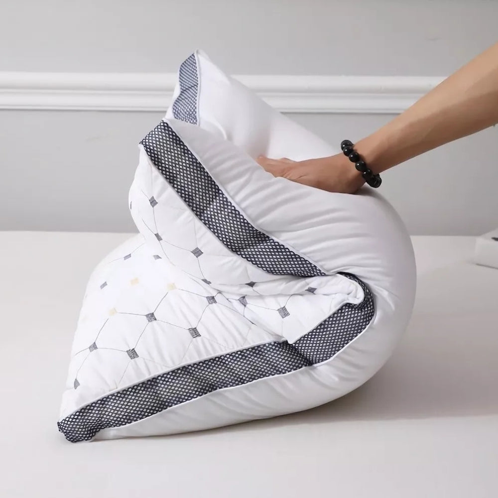 SouthernSoft Luxury Pillow flexed to show bounce-back loft and durable support